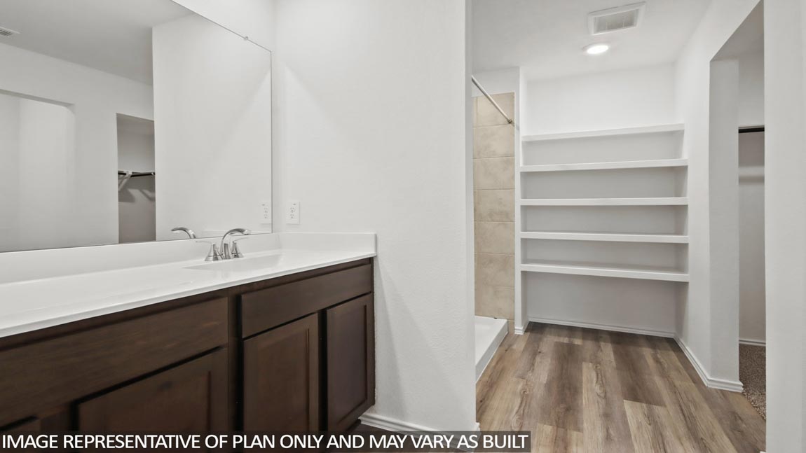 primary bathroom with built in shelving