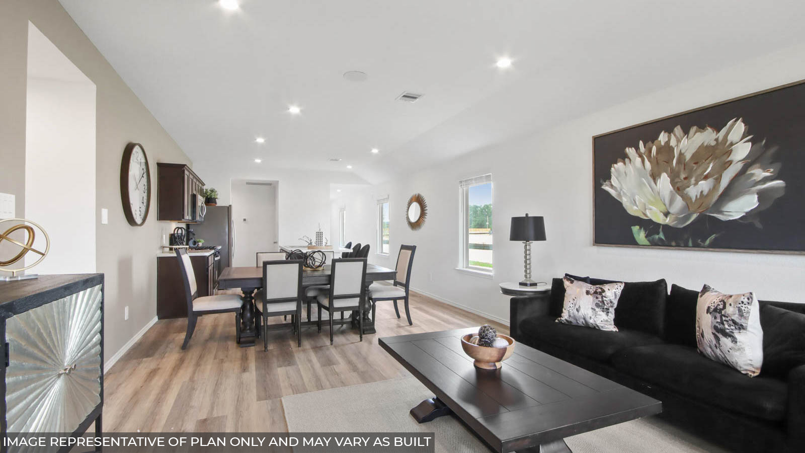 Spacious living area with vinyl flooring