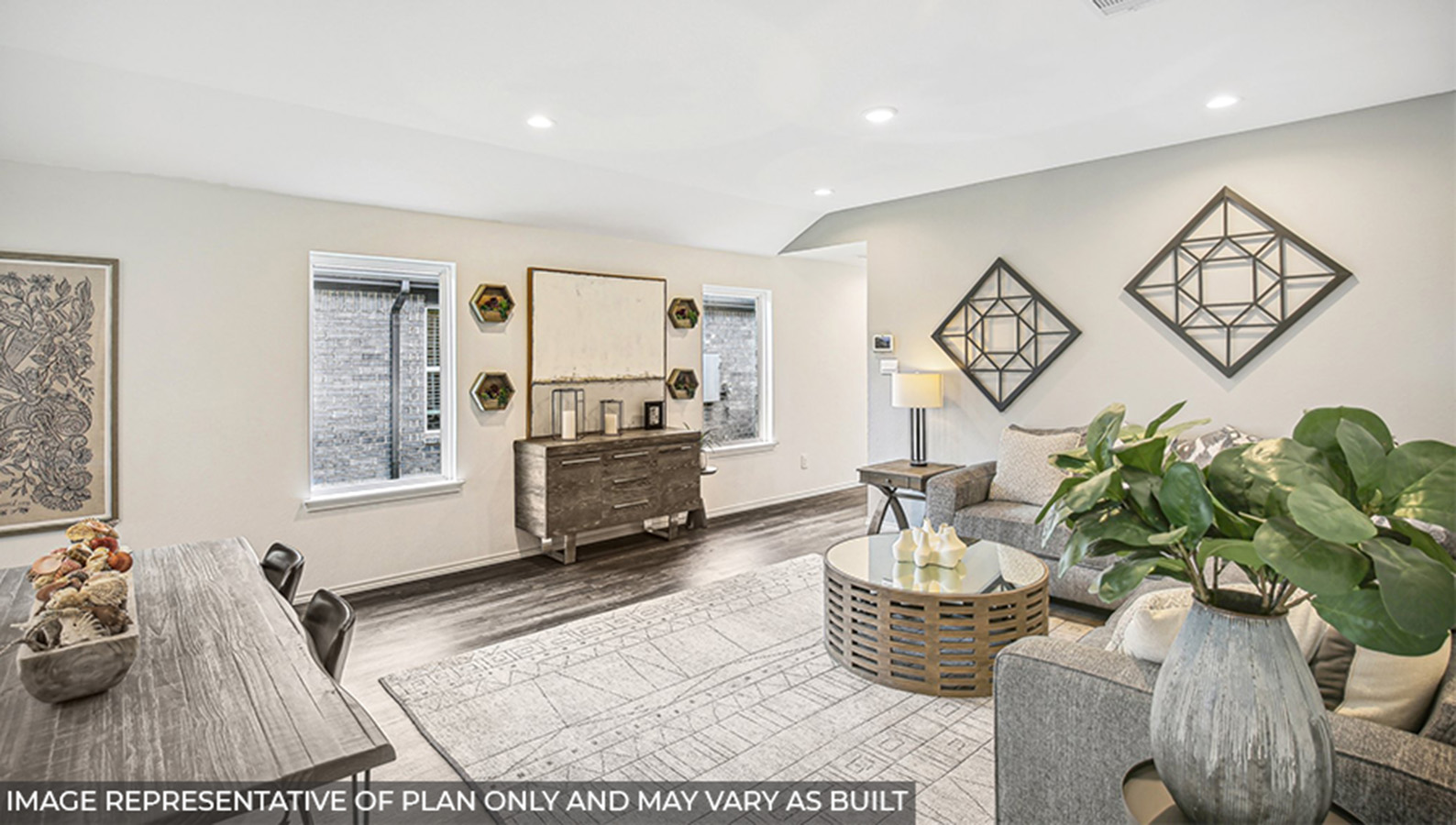 open concept livivng and dining area with vinyl flooring, quartz countertops, and large windows
