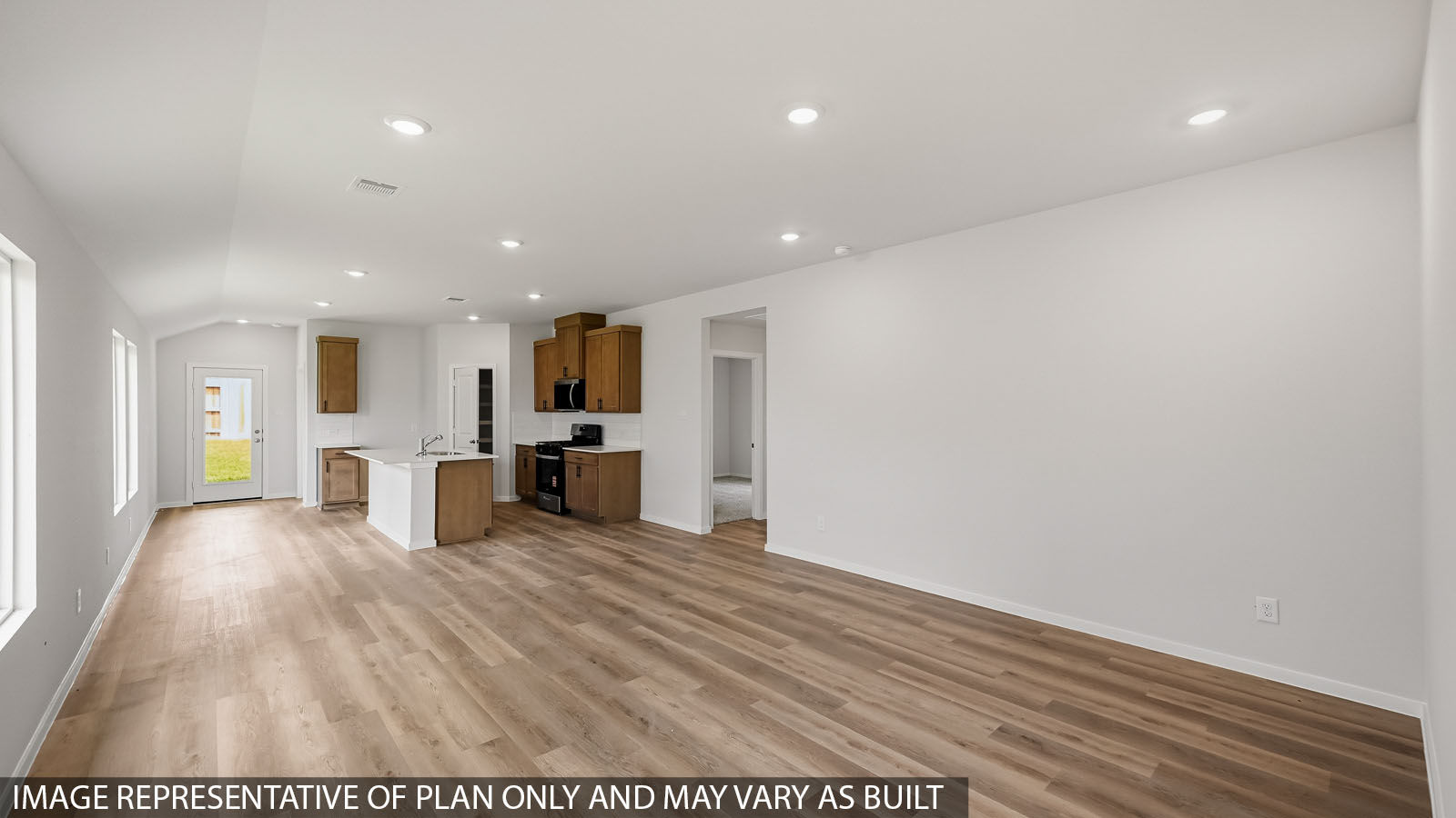 open conccept living and dining area with vinyl flooring and large windows