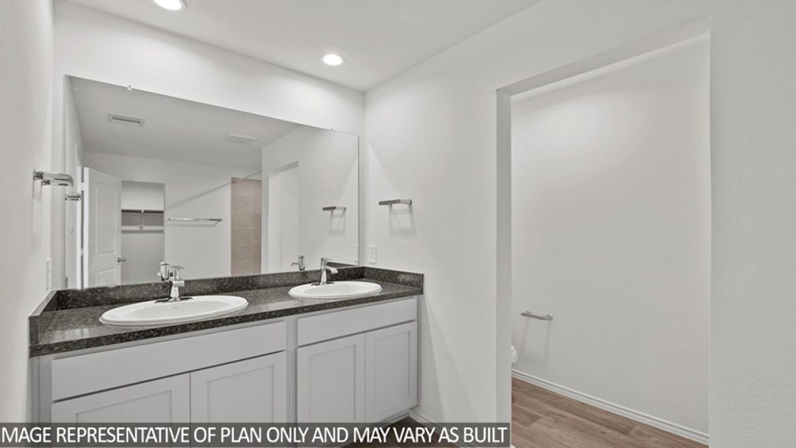 bathroom with tub and shower combo in Hockley, Texas