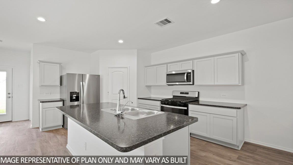open concept livving and dining area with vinyl flooring, and large windows. Located in Hockley, Texas