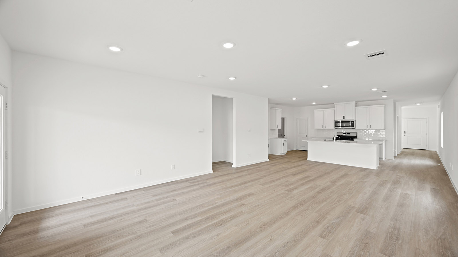 open concept kitchen, living and dining area