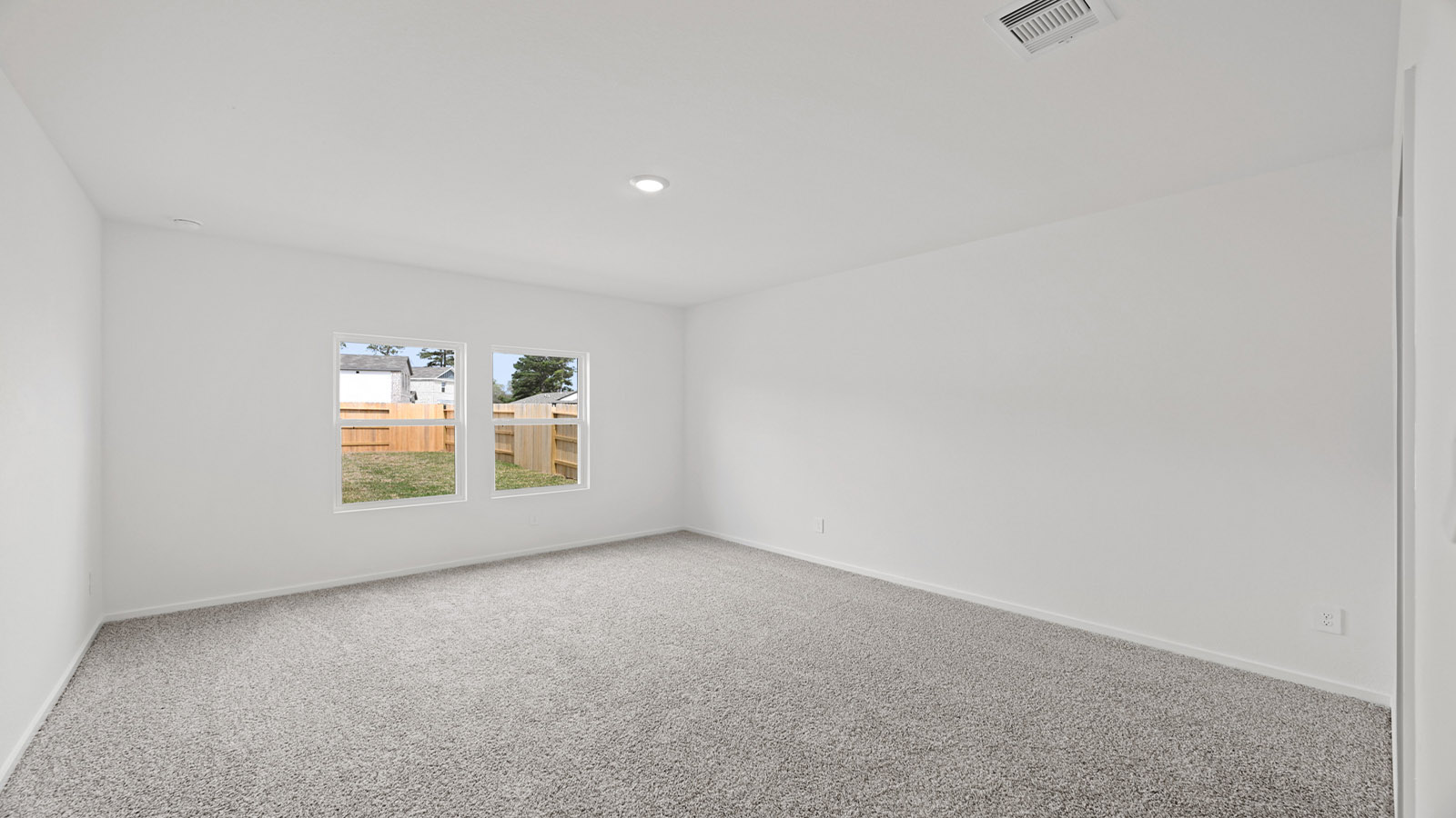 Primary Bedroom with carpet flooring and bright window
