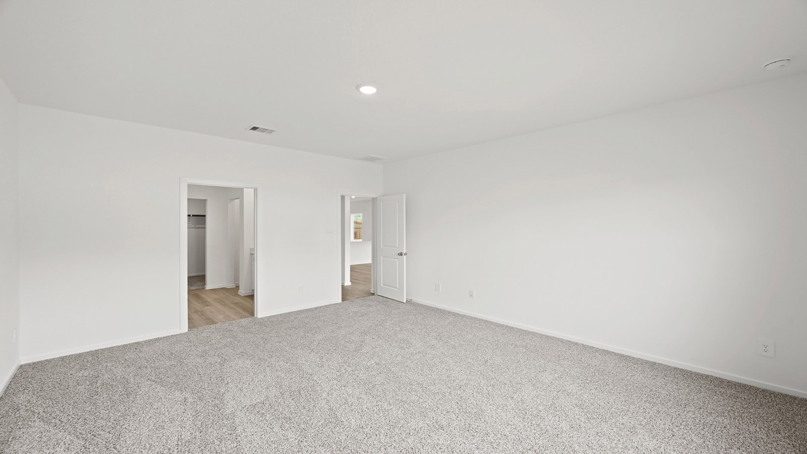 Primary Bedroom with carpet flooring and bright window
