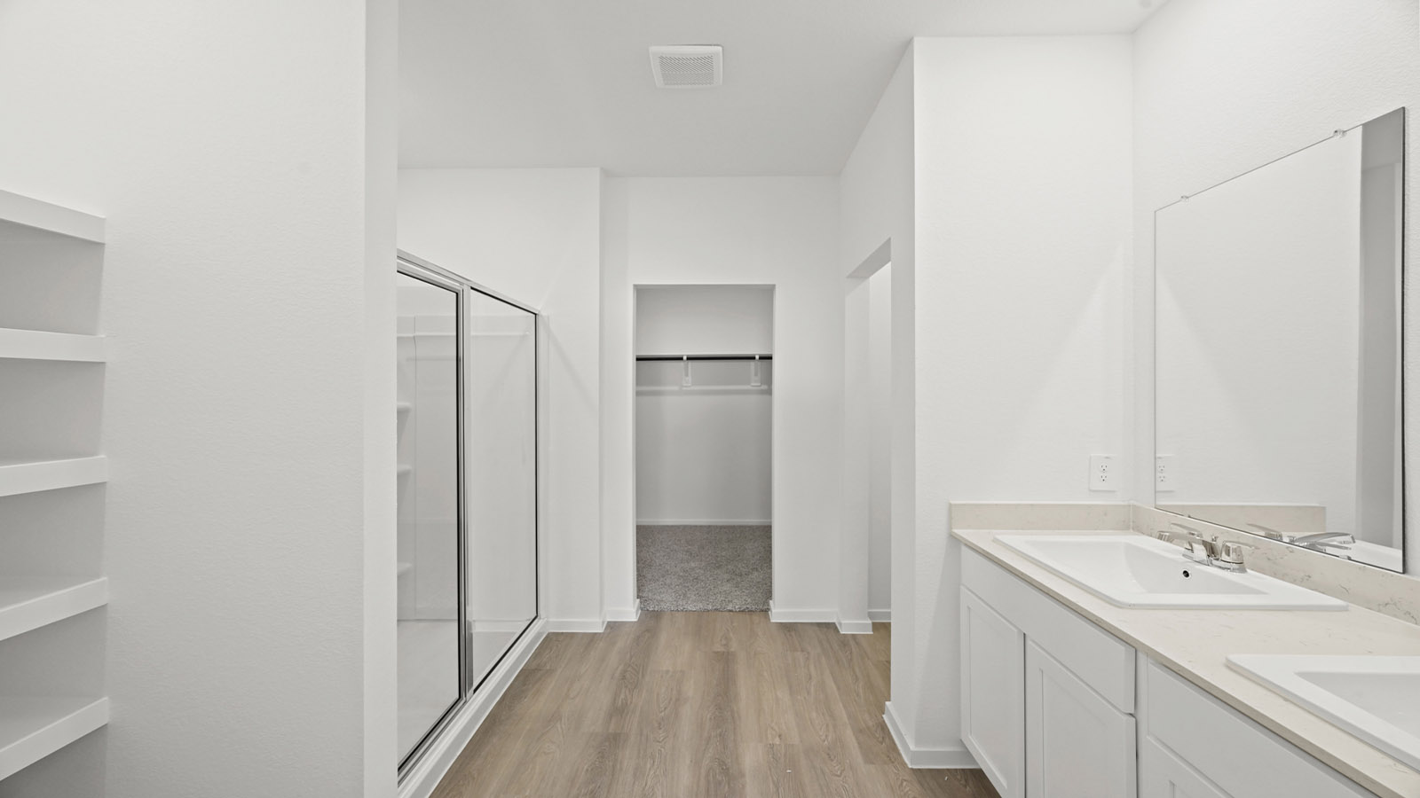 primary bathroom with stand alone shower and linen closet