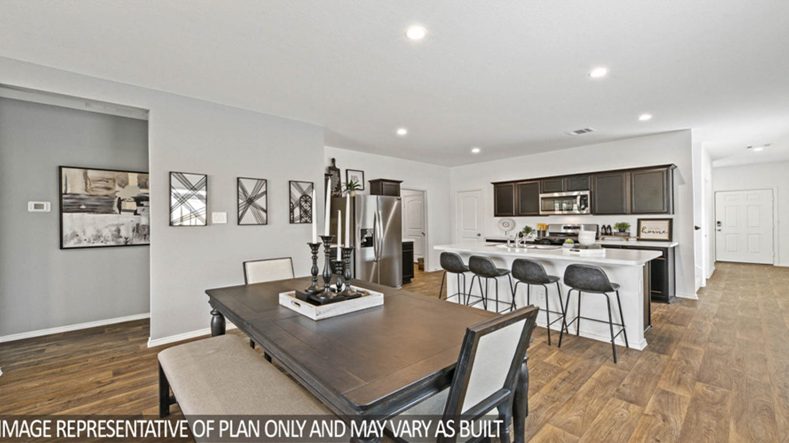 open concept livving and dining area with vinyl flooring