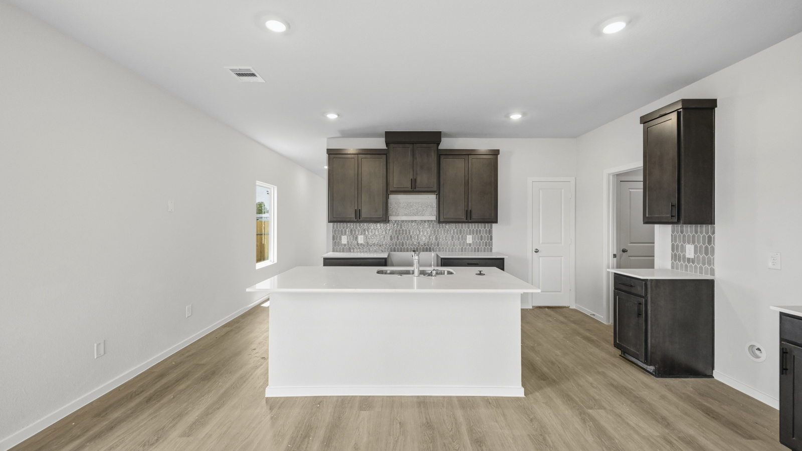 open concept livving and dining area with vinyl flooring
