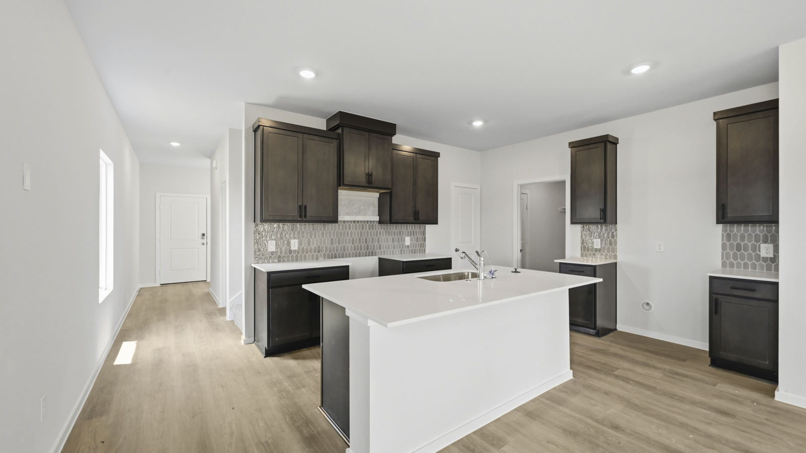 open concept livving and dining area with vinyl flooring
