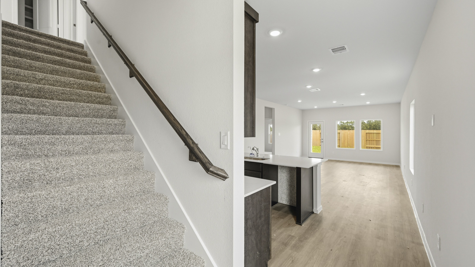 open concept livving and dining area with vinyl flooring