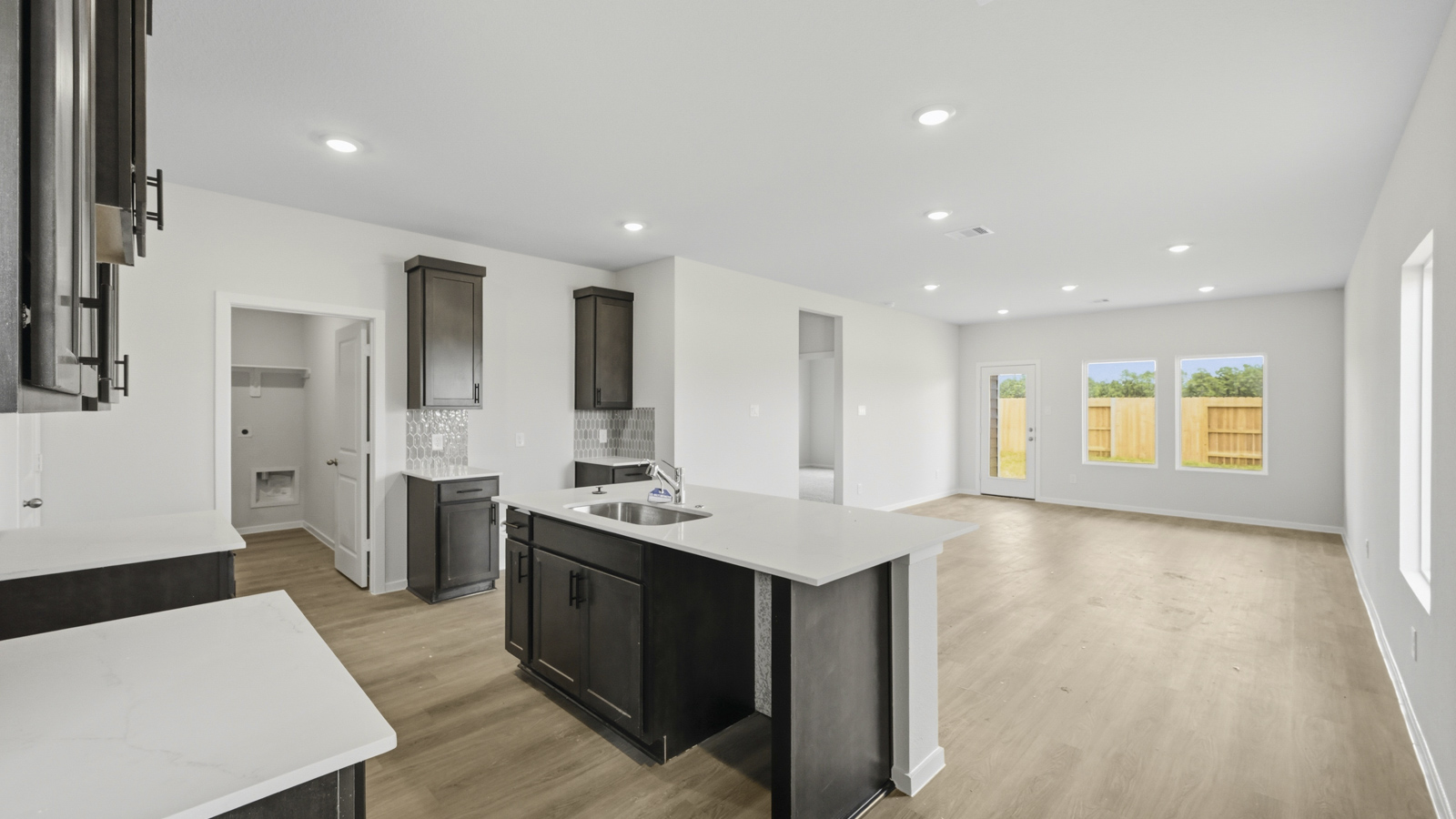 open concept livving and dining area with vinyl flooring