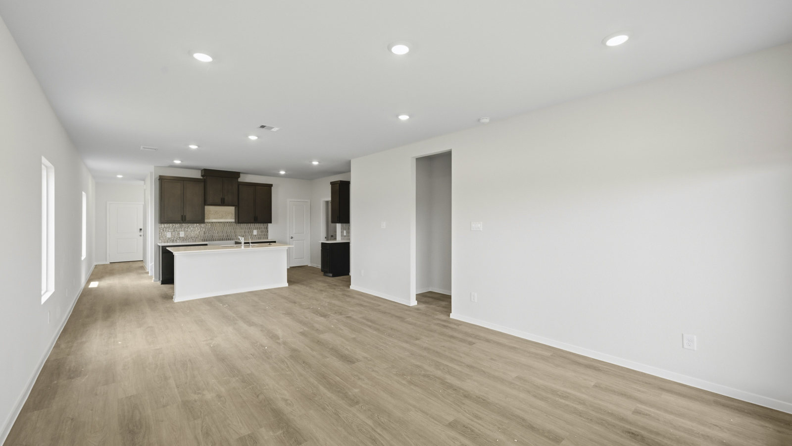 open concept livving and dining area with vinyl flooring