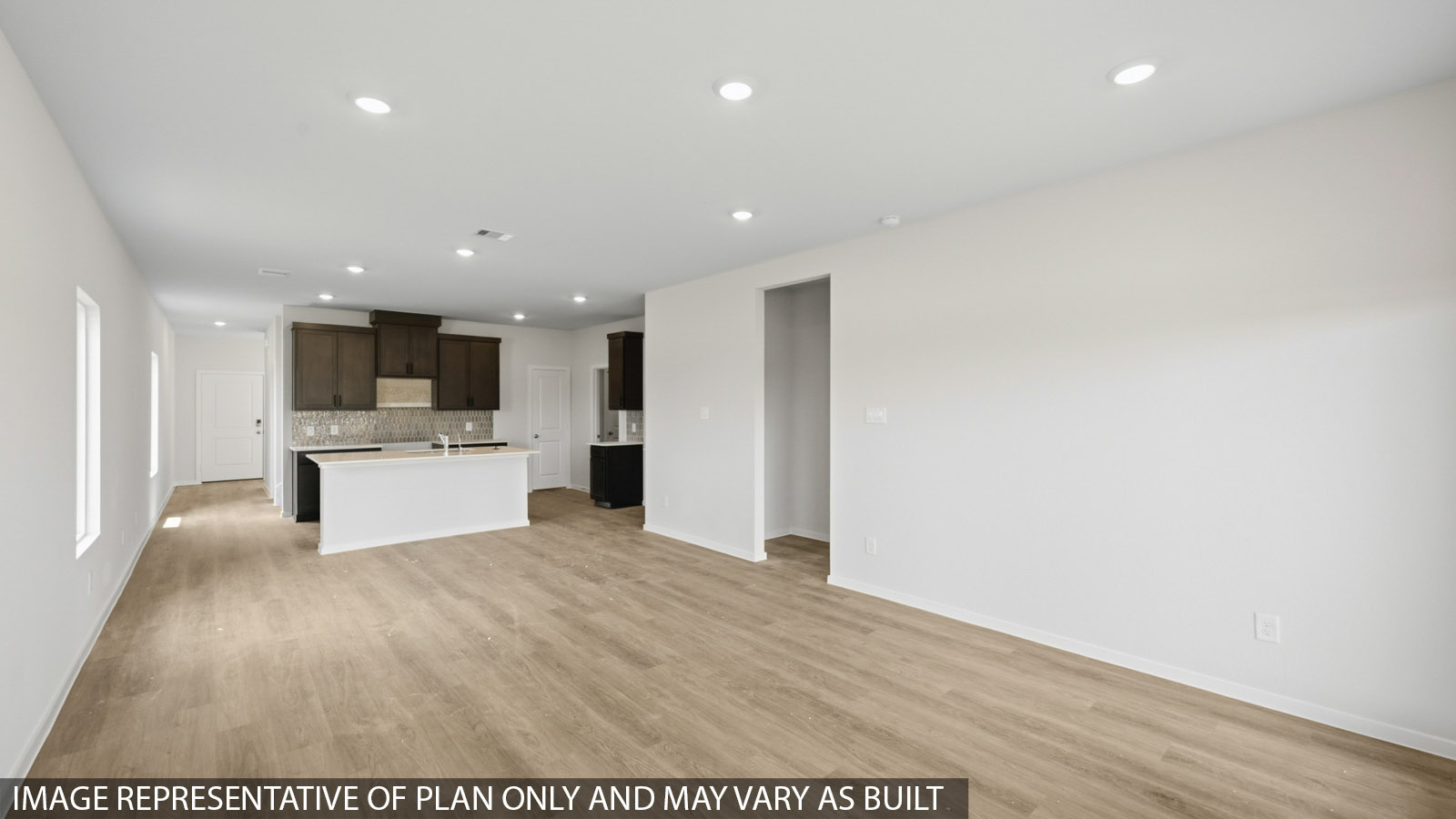 open concept living and dining area with vinyl flooring and large windows