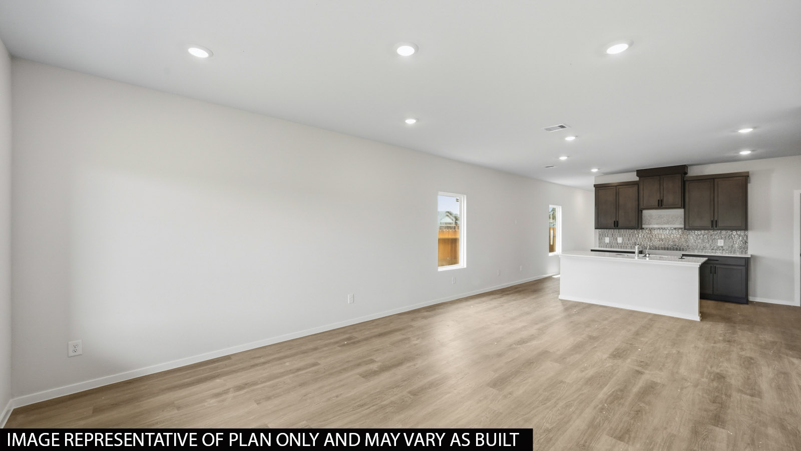 open concept living and dining area with vinyl flooring and large windows