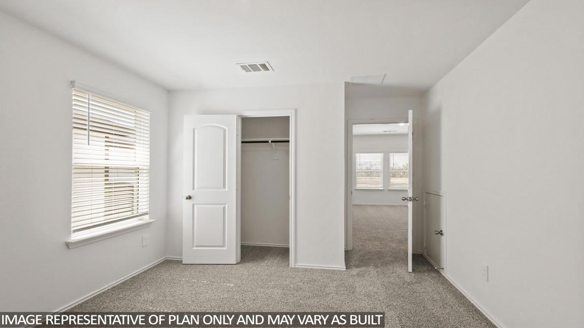 bedroom with carpet flooring and windows