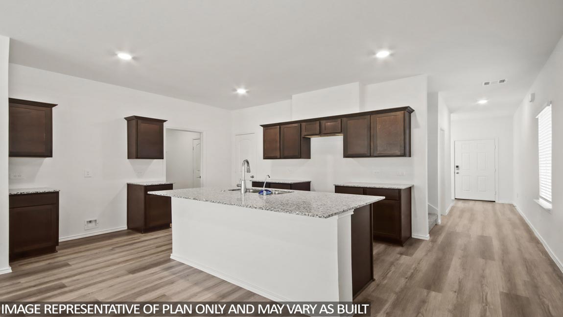kitchenwith quartz countertops and stainless steel appliances