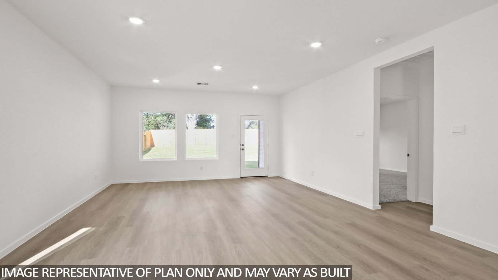 open concept livving and dining area with vinyl flooring, and quartz countertops