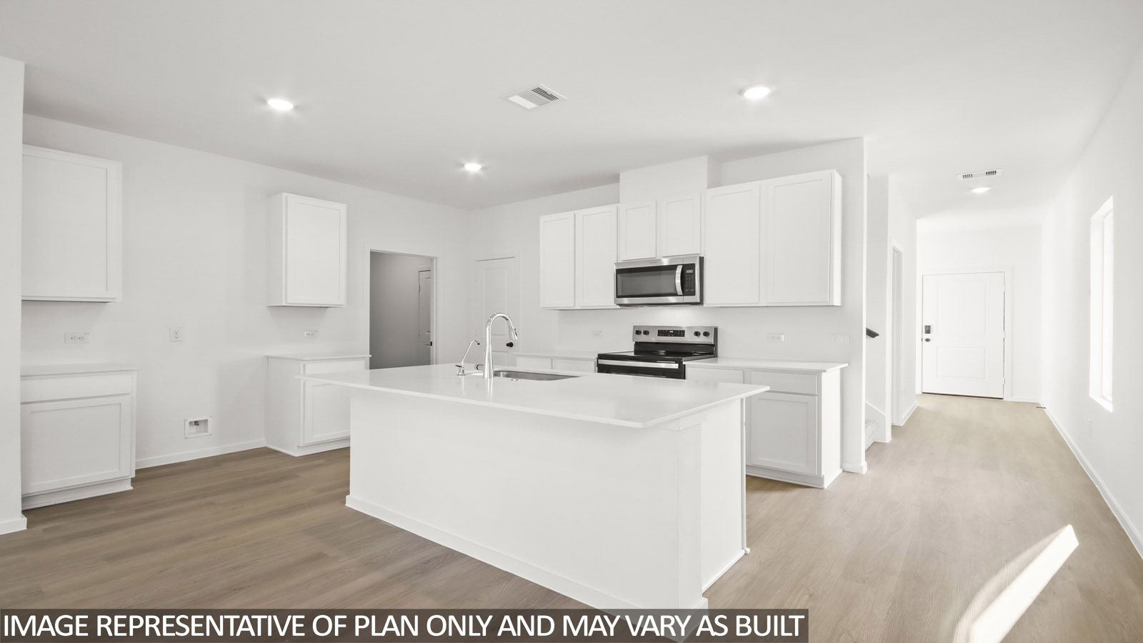 open concept livving and dining area with vinyl flooring, and quartz countertops