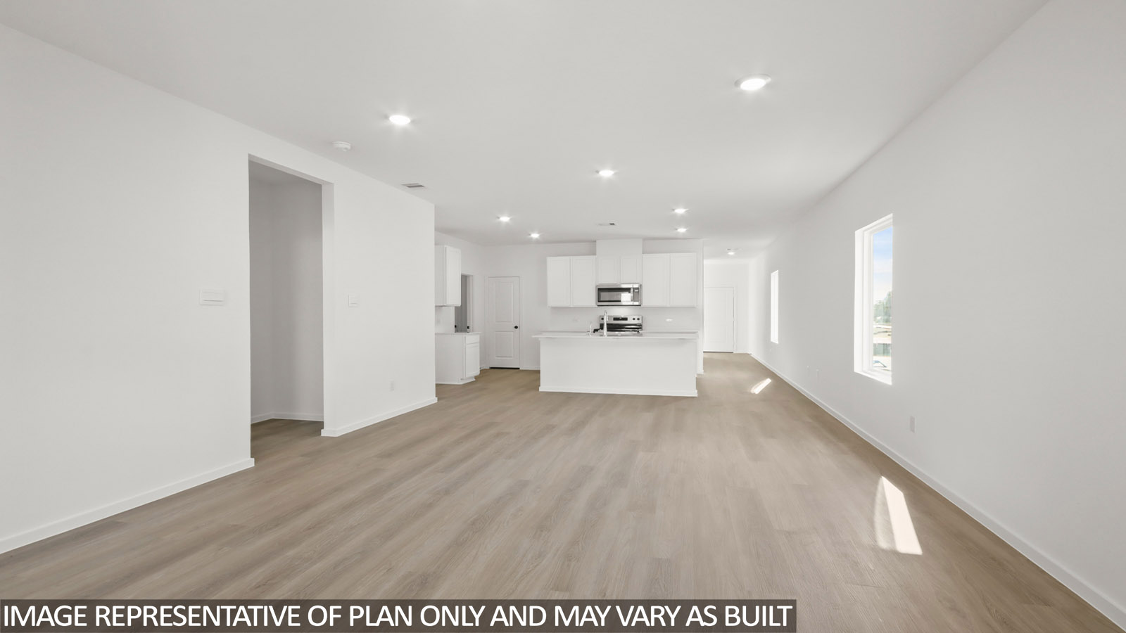 open concept living and dining area with vinyl flooring, quartz countertops, and large windows