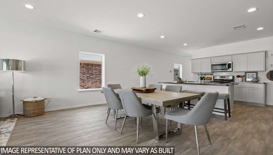 open concept living and dining area with vinyl flooring and large windows
