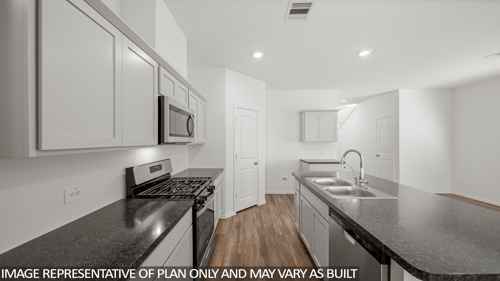 open concept living and dining area with vinyl flooring, quartz countertops, and large windows