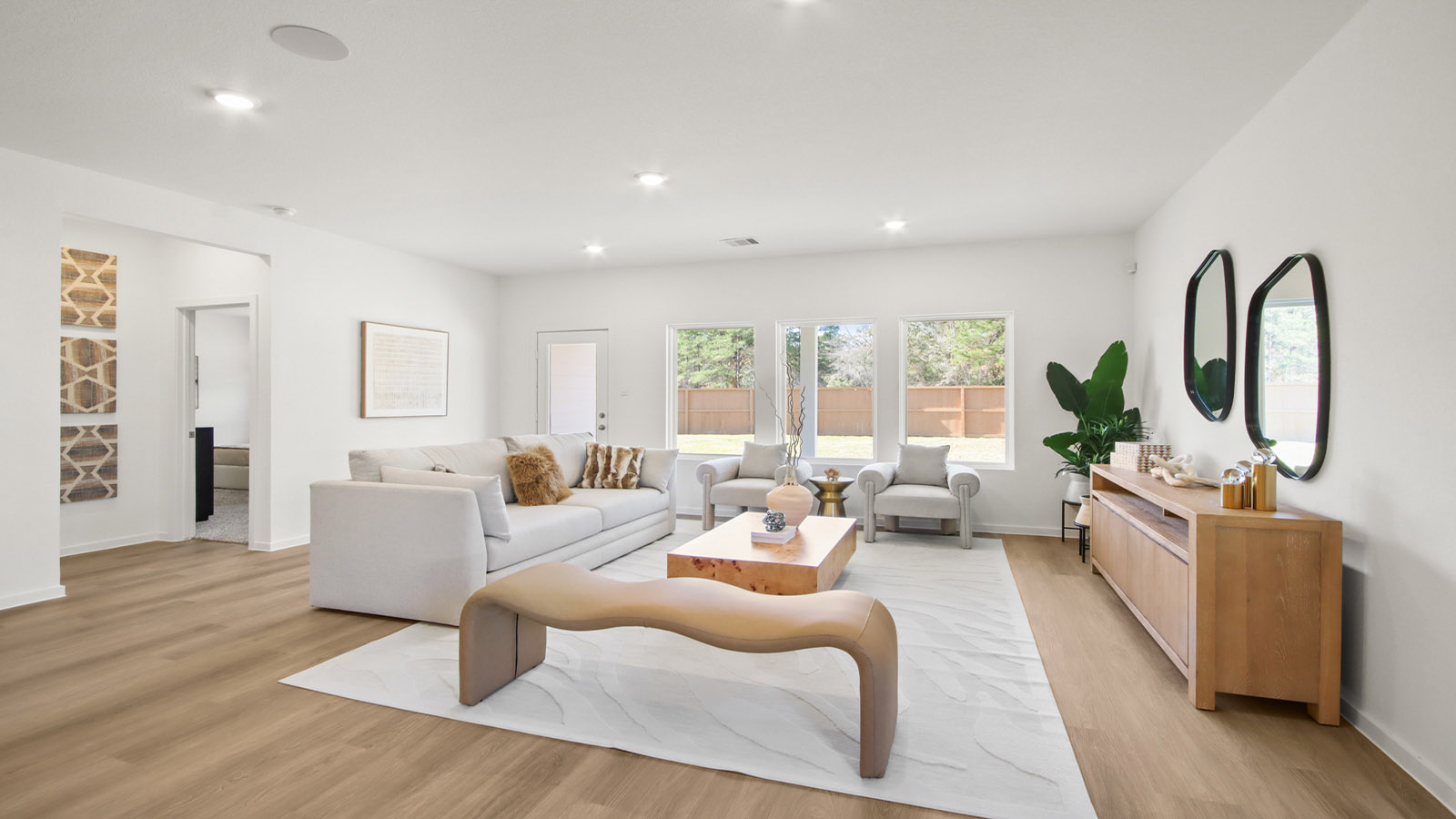 open concept living and dining area with vinyl flooring and large windows