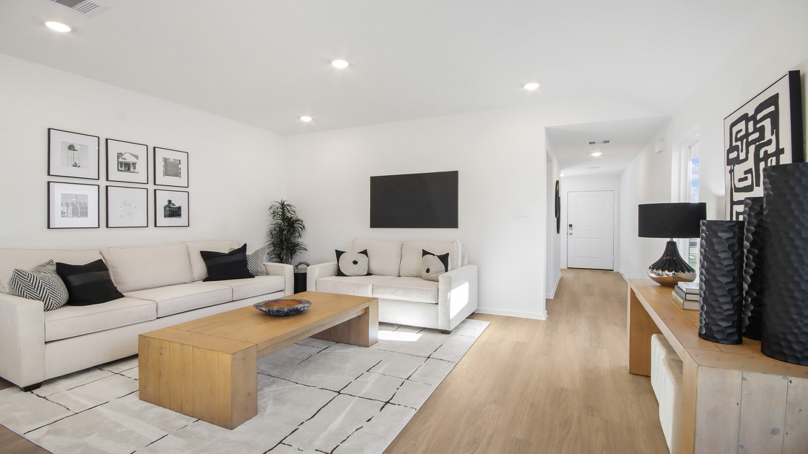 open concept living and dining area with vinyl flooring and large windows