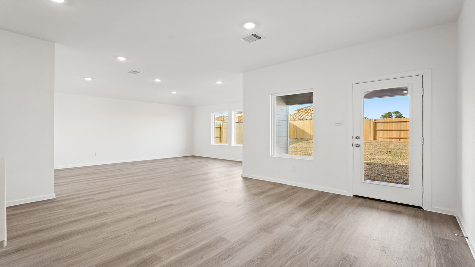 Open concept living, dining, and kitchen area