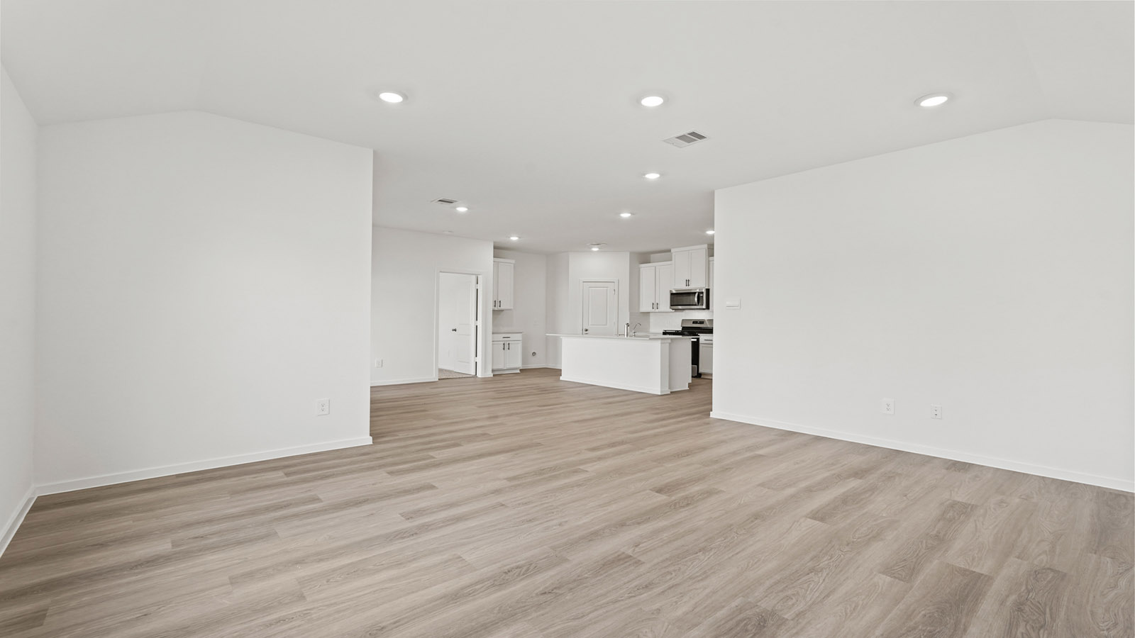 Open concept living, dining, and kitchen area