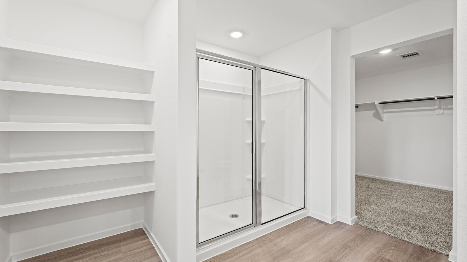 primary bathroom with built in shelves