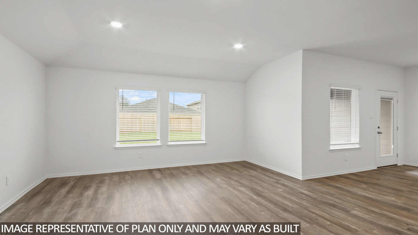 open concept living and dining area with vinyl flooring, large windows, and quartz countertops in Hockley, TX