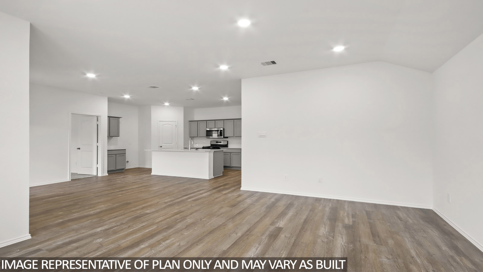 open concept living and dining area with vinyl flooring, large windows, and quartz countertops in Hockley, TX