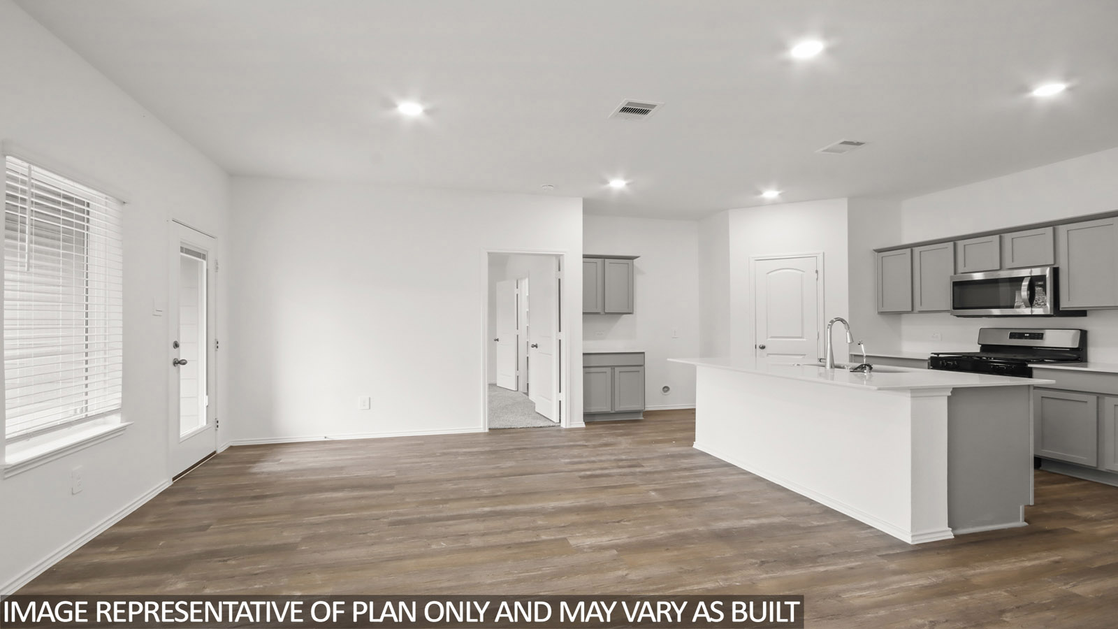 open concept living and dining area with vinyl flooring, large windows, and quartz countertops in Hockley, TX