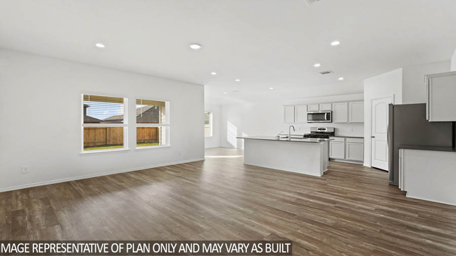 open concept living and dining area with vinyl flooring