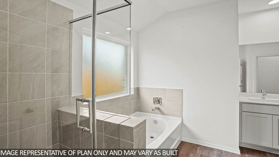 primary bathroom with tub and shower