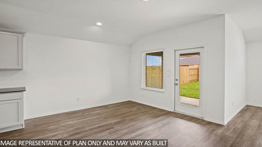 open concept living area with vinyl flooring and large windows