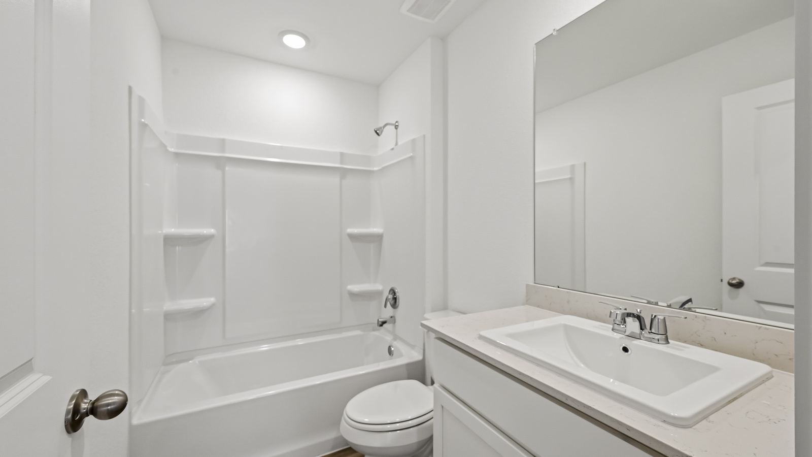 Secondary bathroom with tub/shower combo with quartz counter tops in Hockley TX