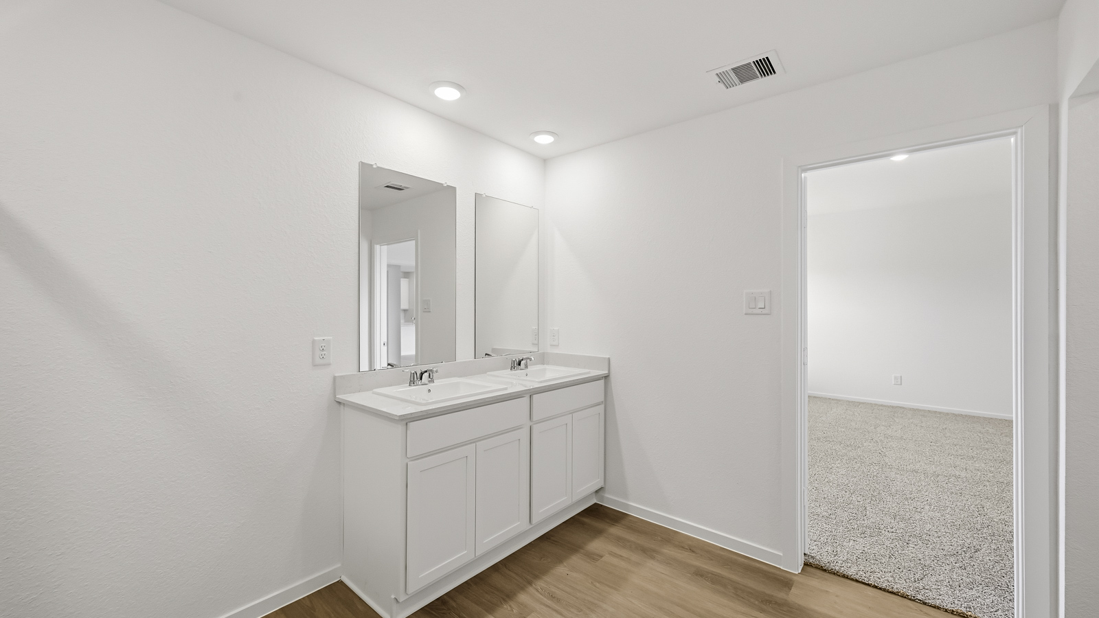 Primary bathroom with soaker tub and tile shower with semi frameless glass in Hockley TX