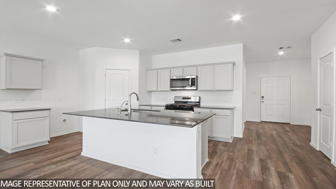 open concept living and dining area with vinyl flooring and lare window