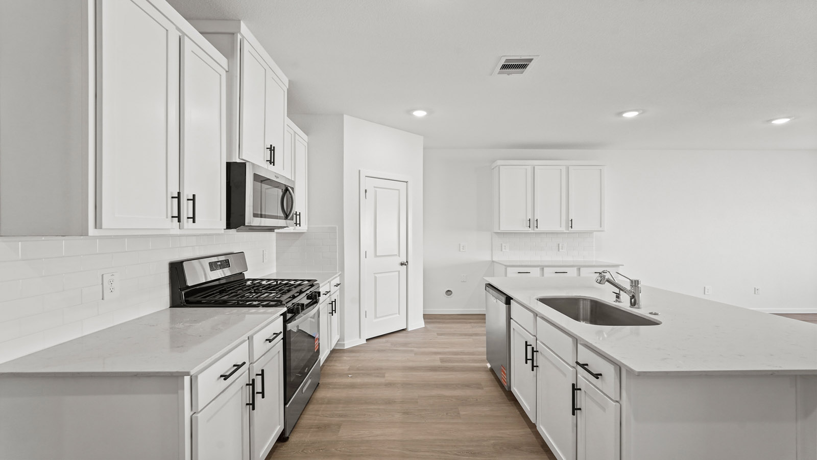open concept living and dining area with vinyl flooring