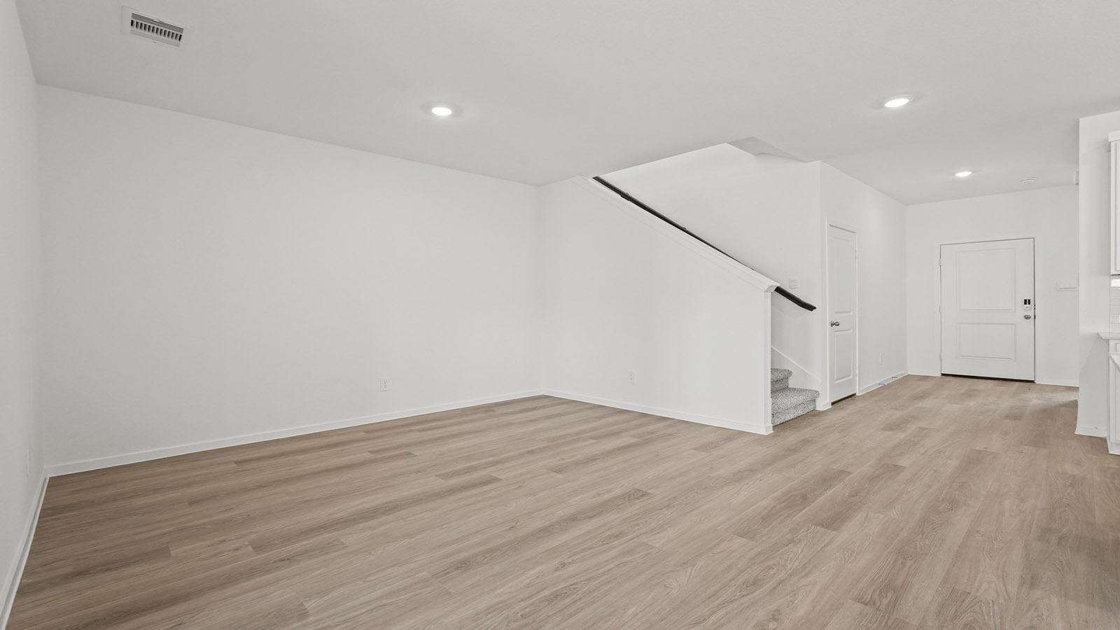 open concept living and dining area with vinyl flooring