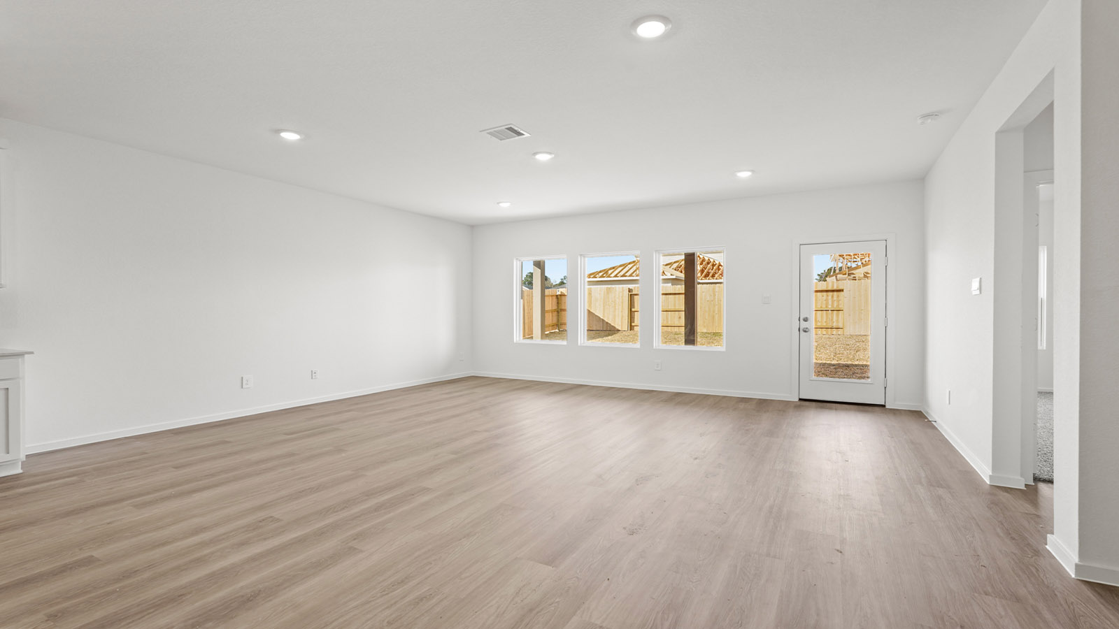 open concept living and dining area with vinyl flooring