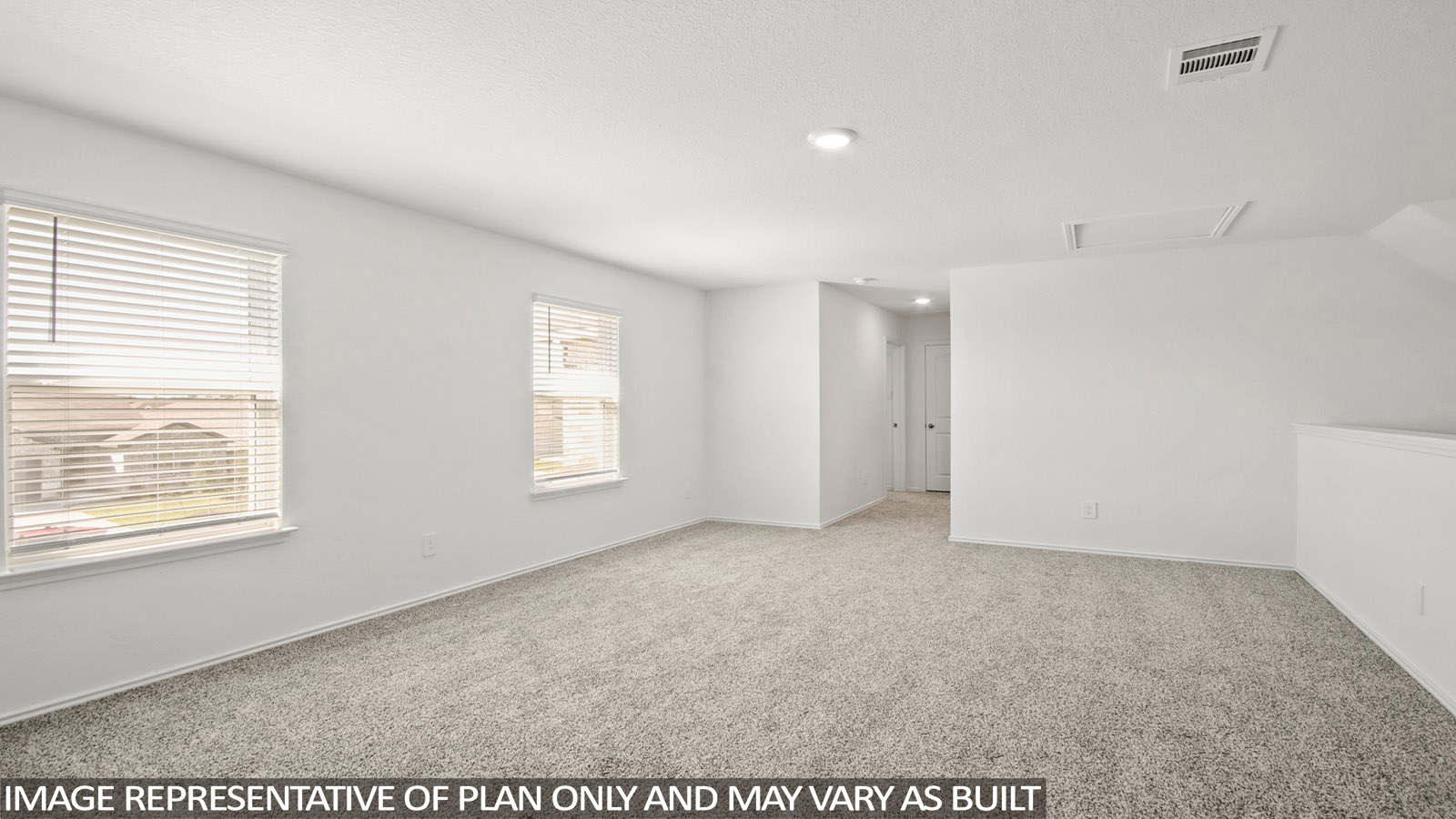 Secondary bedroom with carpet flooring