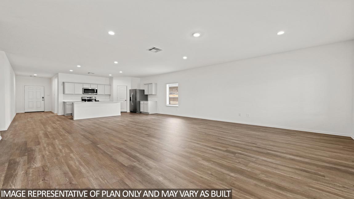 open concept living and dining area with vinyl flooring, large windows, and quartz countertops