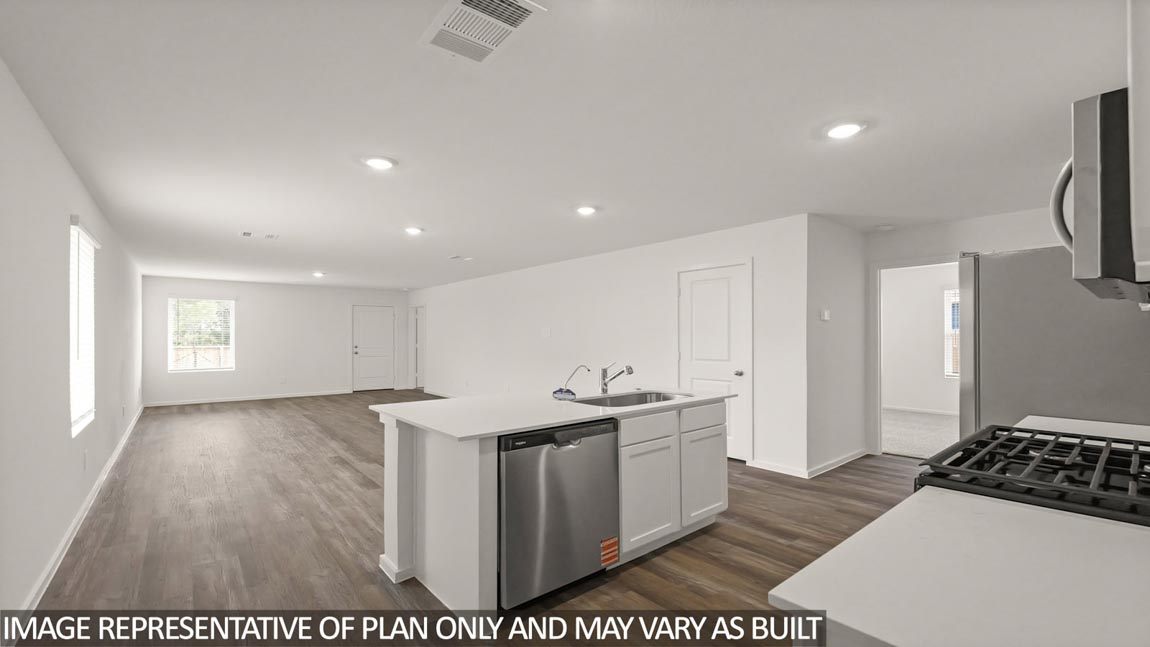 Kitchen with an island and vinyl floor