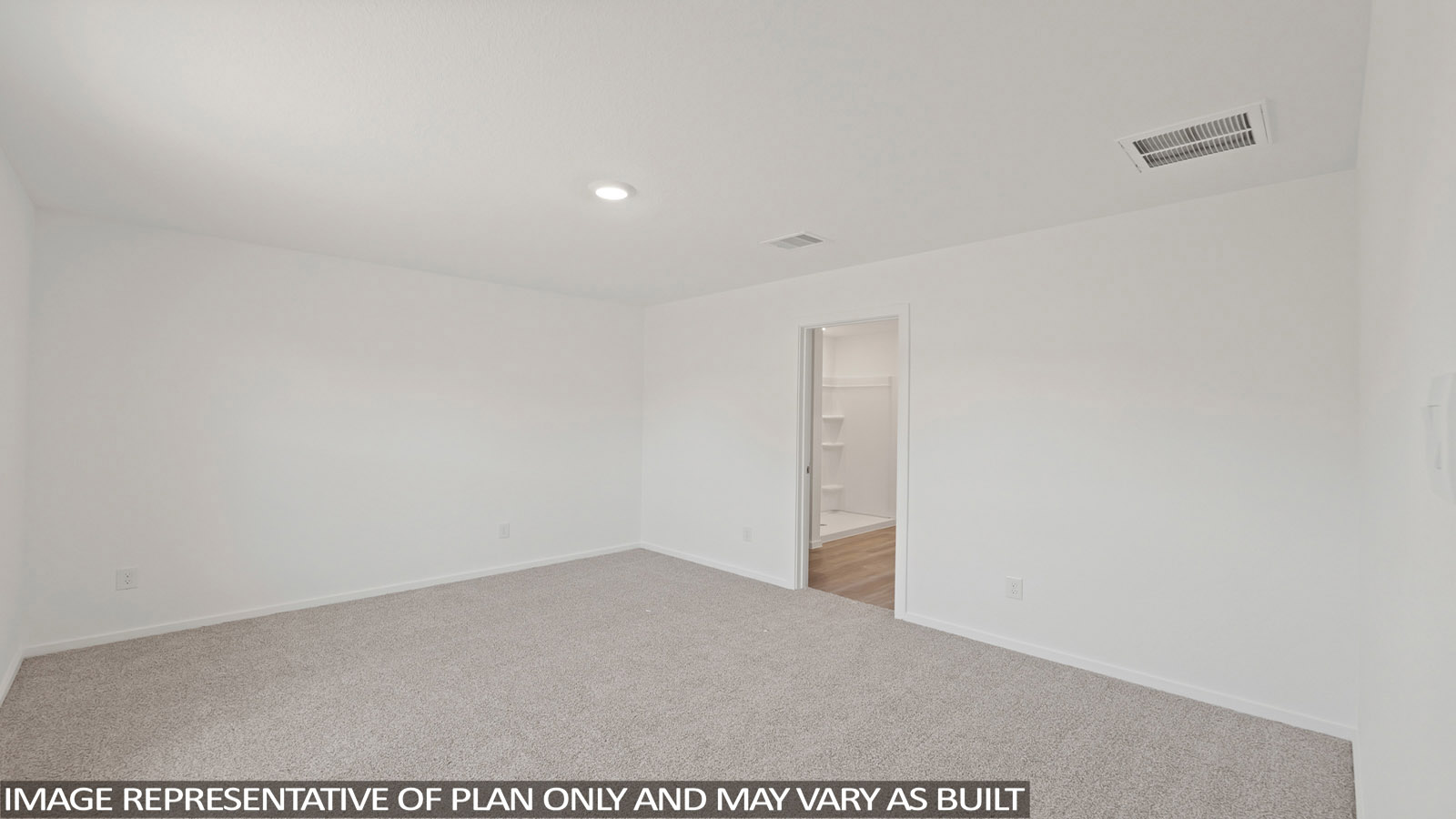 Secondary bedroom with carpet flooring