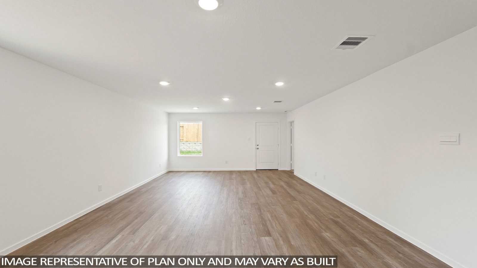 Spacious living area with vinyl flooring and bright windows in Willis TX