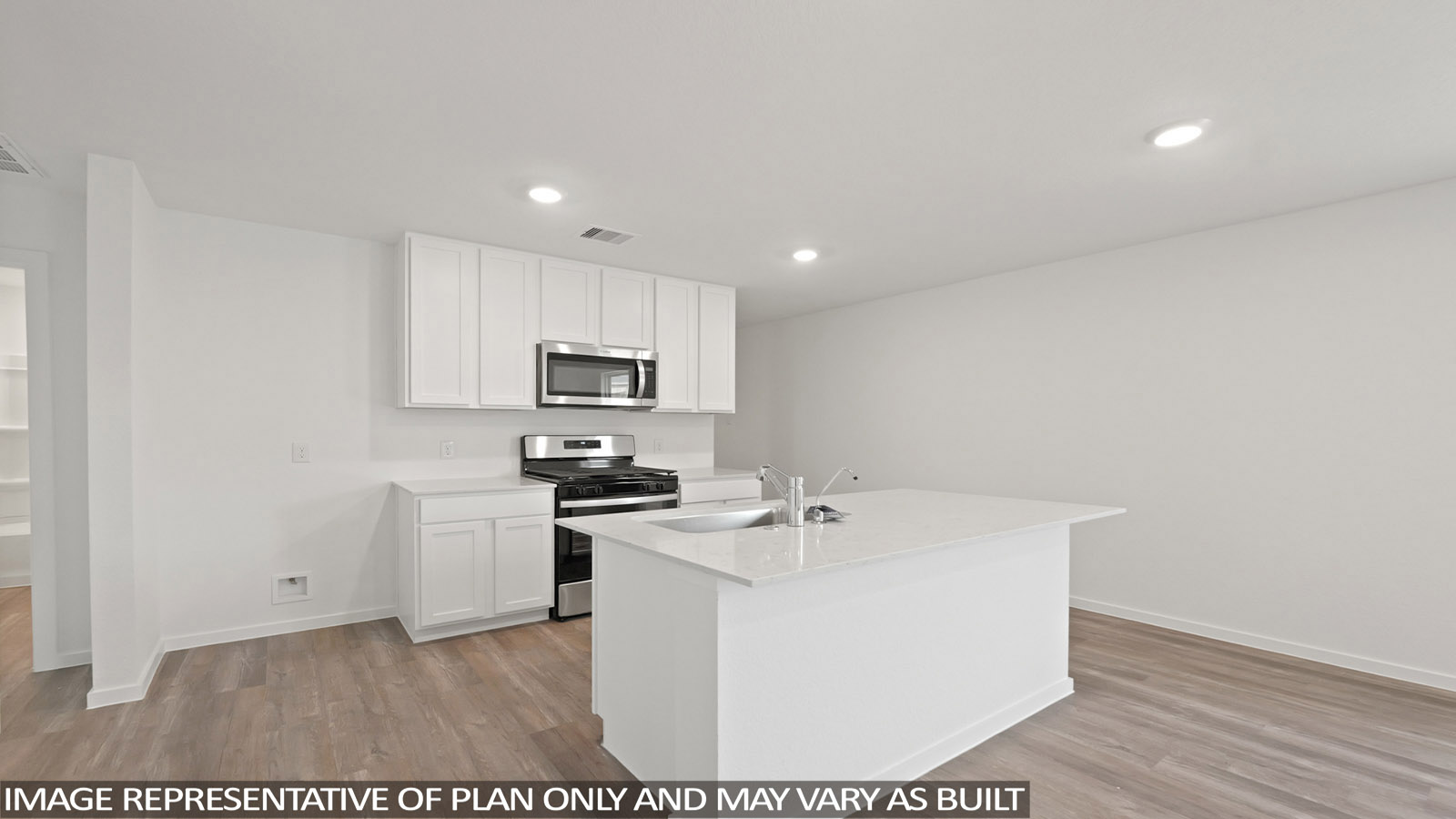 Kitchen with quartz countertops and an island and vinyl floor
