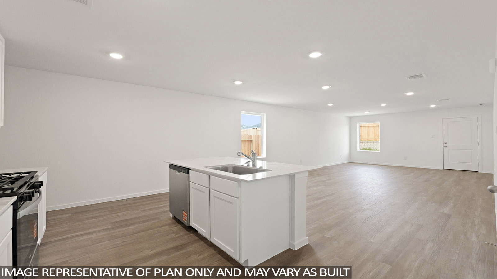 Kitchen with quartz countertops and an island and vinyl floor