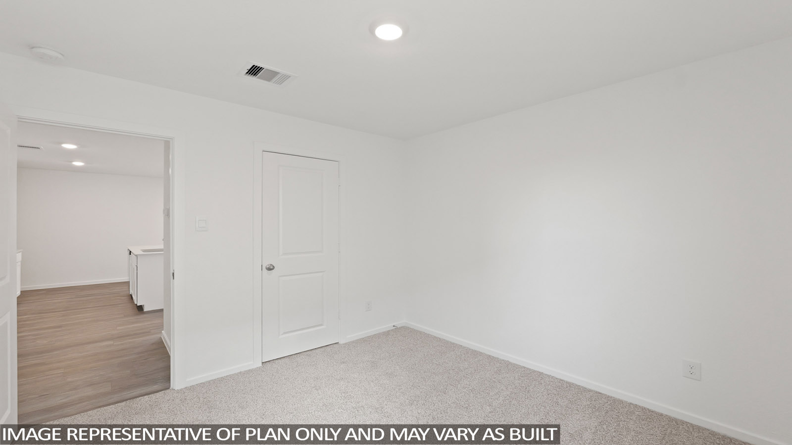 Secondary bedroom with shag carpet flooring and bright window